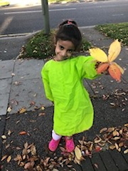 Girl In Green Dress Holding Leaves Girl In Green Dress Holding Leaves